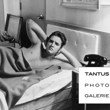 Elvis Presley in bed, ca. 1957