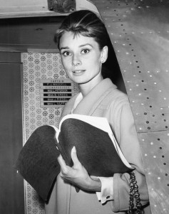 Audrey Heburn, with her script for BREAKFAST AT TIFFANY'S, returning to Los Angeles from New York lo